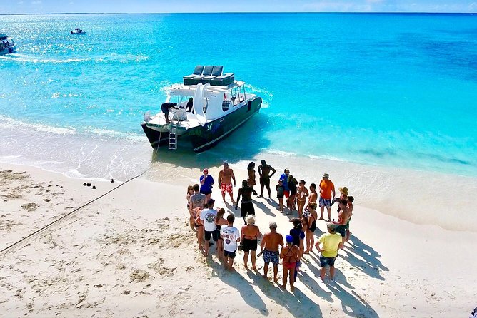 4hour Group Half Day Snorkeling Excursion in Grace Bay - The return swim stop, slides, and rooftop jump