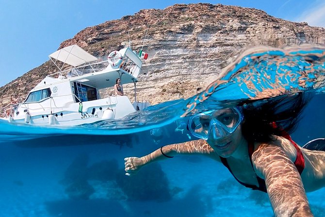 7 hours Boat trip to Lampedusa lunch, SUP and Snorkeling - Why Lampedusa Makes More Sense From the Water