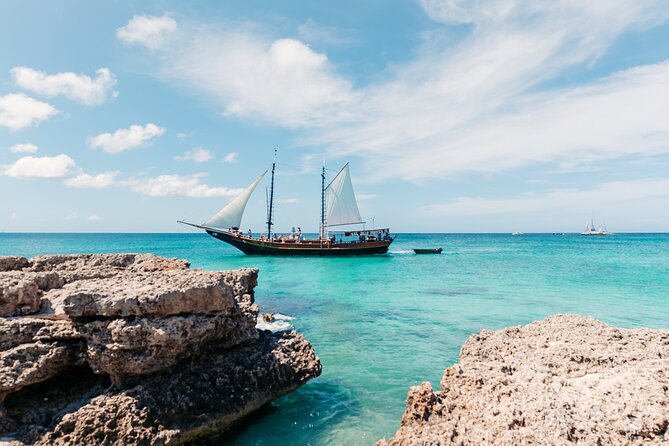 Aruba Jolly Pirate Afternoon Sail with Snorkeling - The rope swing brings the pirate-ship theme to life