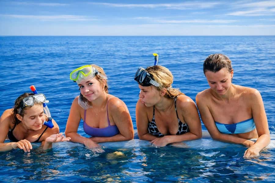 Bali/Lovina: Guided Dolphin Watching & Sunrise Boat Snorkel - Swimming beside the boat