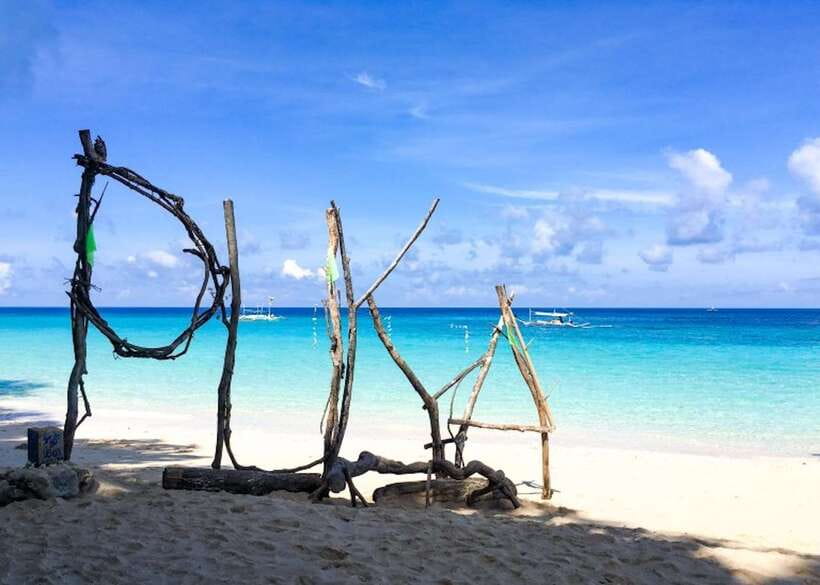 Boracay: Island and Beach-Hopping Boat Tour with Snorkeling - Puka Beach: your first proper swim