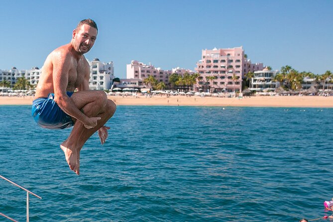 Cabo San Lucas Boat Tour with Snorkeling, Open Bar, and Lunch - Divorce Beach and the dramatic Land’s End coast