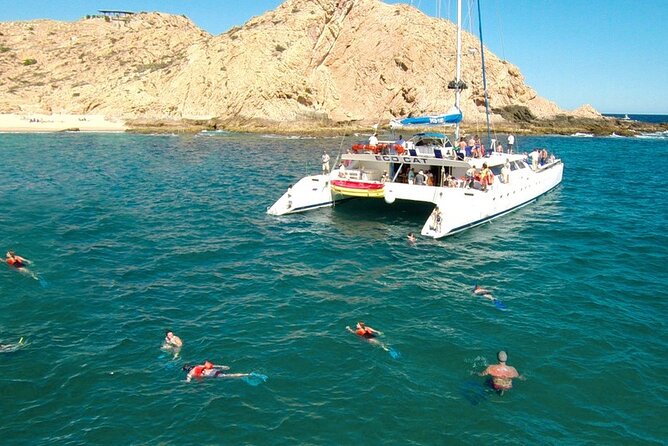 Cabo San Lucas Catamaran Cruise: Snorkel or Sunset Adventure - El Arco and Lover’s Beach from the sea