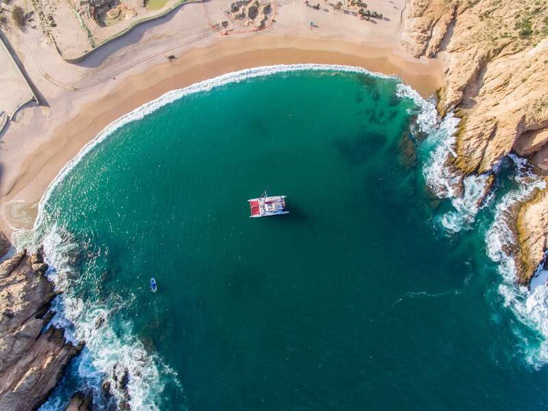 Cabo San Lucas: Snorkel, Lunch and Sail Experience - Open-bar drinks and a lively atmosphere