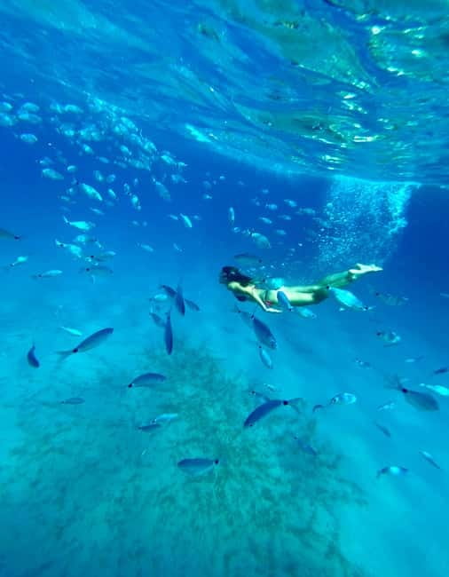 Cagliari: Boat Tour with Snorkeling, GoPro & Sardinian Beer - Devil’s Saddle from the water