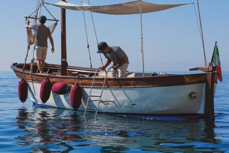 Cagliari: Gozzo Tour with 3 Swim Stops, Snorkel & Local Food - Cala Bernat begins the coastal views
