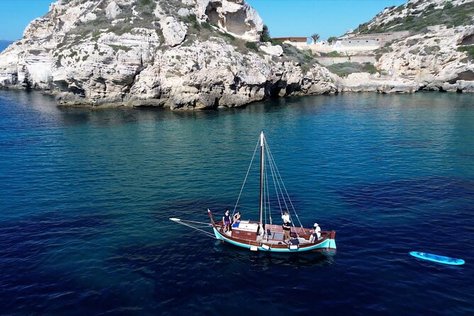 Cagliari Gulf Boat tour : 5 stops, snorkeling & local aperitif - Leaving Marina Piccola on a Wooden Gozzo