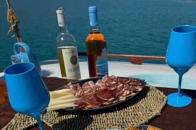 Cagliari Gulf Boat tour : 5 stops, snorkeling & local aperitif - Calamosca Beach and Emerald Water