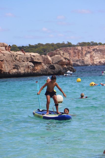 Cala des Moro/S'Almunia: Snorkel and SUP Tour - Paddleboarding beside cliffs and old coastal homes
