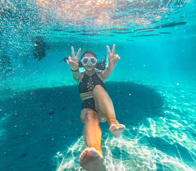 Can Picafort: 2-Hour Boat Tour with Snorkeling & Sea Caves - Reaching Coll Baix by boat