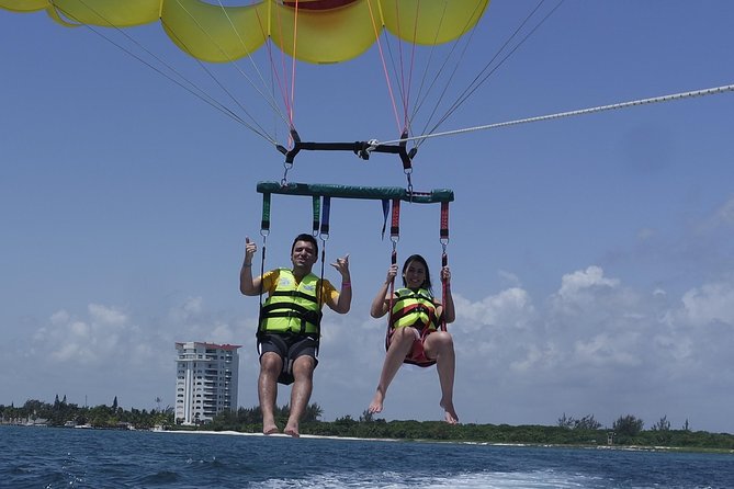 Cancun Adventure: Reef Snorkeling & Parasailing Experience - Parasailing over the Caribbean