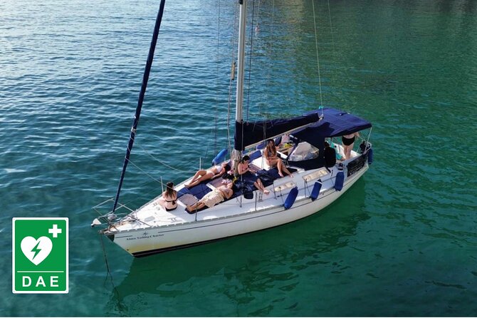 Catamaran tour stops bathing and snorkeling toast with prosecco - Cala Mosca and the first coastal views