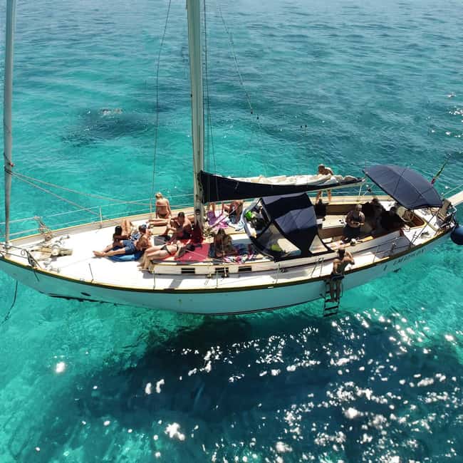 Catania: Boat Trip with Aperitif, Prosecco and Snorkeling - The Ulysses Caves and Aci Castello