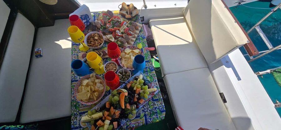 Cefalù: Coast-to-coast boat day trip with snorkeling and aperitif - Food, drinks, and the pace onboard