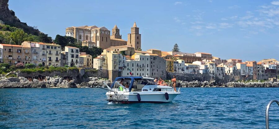 Cefalù: Coast-to-coast boat day trip with snorkeling and aperitif - Mazzaforno Beach: the first swim stop