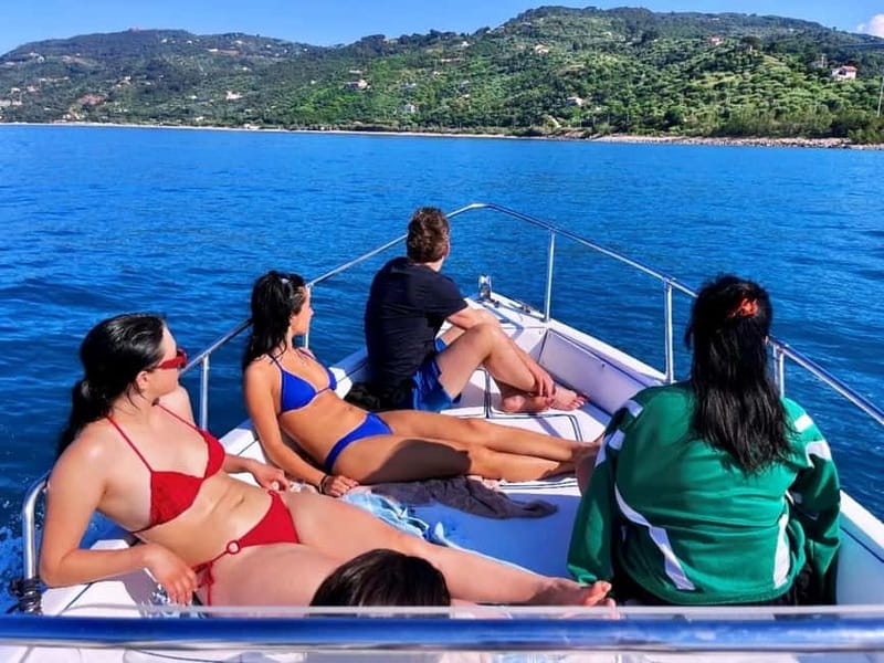 Cefalù: Mini Yacht Tour with Caves, Snorkeling, and Open Bar Aperitif - Cefalù’s pier and waterfront from the water
