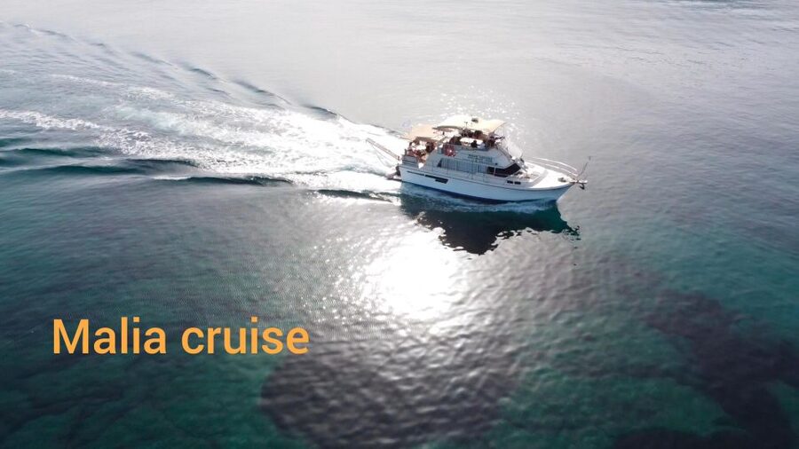 Crete: Snorkeling Boat Trip with Lunch and Transfer - Saint George Bay adds scenery between swims