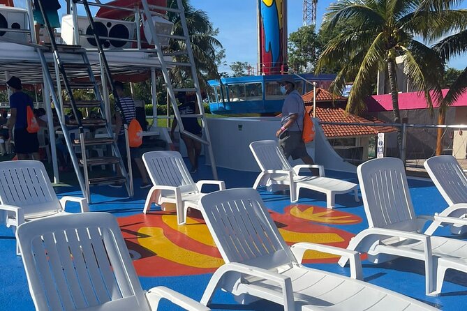 Dancer Cruise Isla Mujeres Snorkel Food and Drinks Included - Slide, trampoline, and open-water swimming