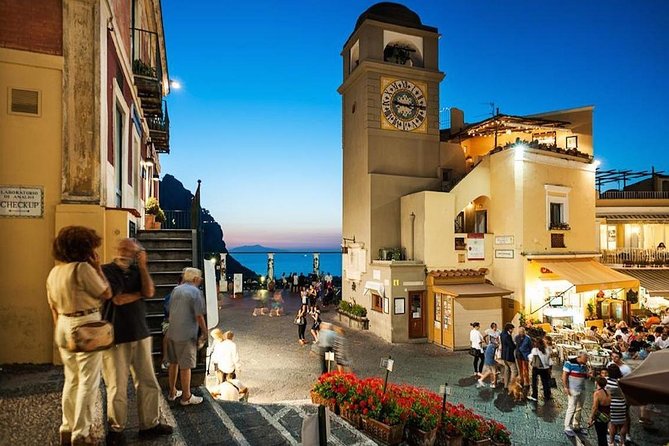 Day to Night Capri Boat Tour with Swim, Snorkel & Aperitif - Going ashore in Capri after the crowds thin
