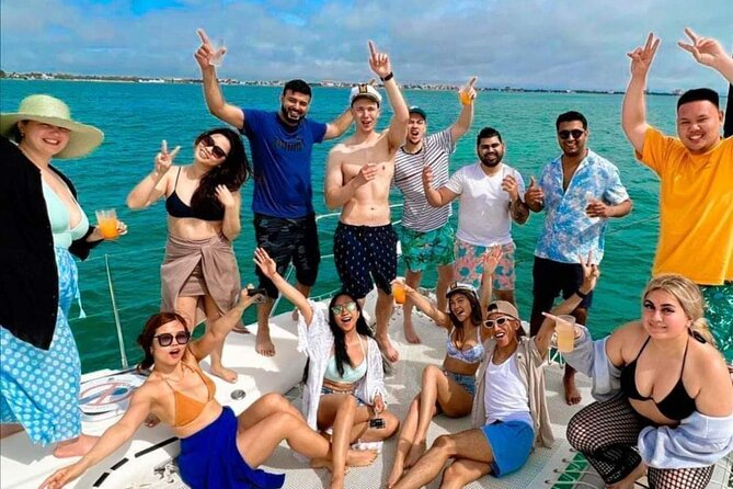 Deluxe Catamaran to Isla Mujeres, with Drinks, Snorkel & Buffet - Mexican buffet and beach club finish