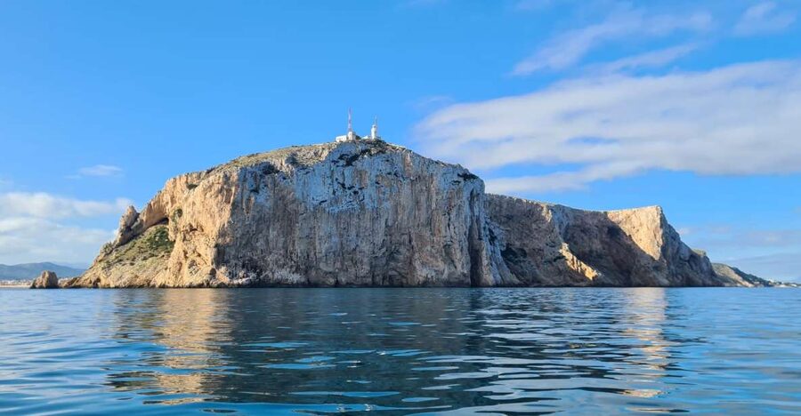 Denia: Cabo San Antonio Snorkeling Tour - Swimming below the lighthouse