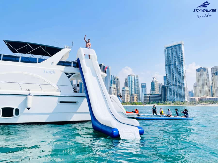 Dubai: Yacht Cruise with Swimming, Snorkeling and BBQ Lunch - Swimming, the floating pool, and the slide