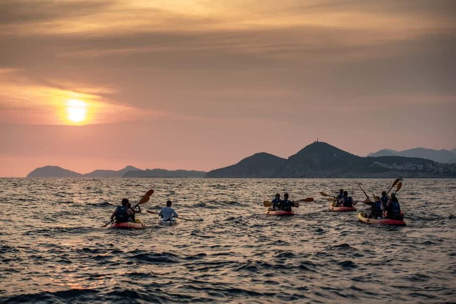 Dubrovnik: Sunset Kayaking and Snorkeling Tour - Returning beside the city walls