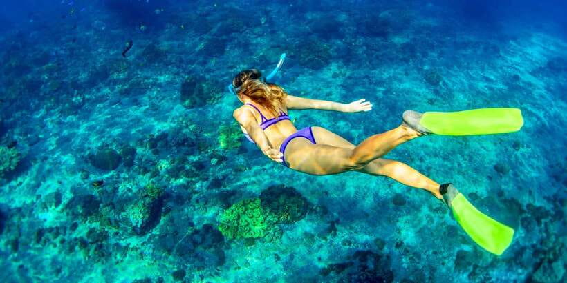 East Bali: Snorkeling Day Trip to Amed - A traditional jukung makes the short boat ride special
