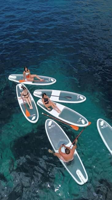 Experience Crystal paddle surf Tours + snorkel - Meeting at Cala Llonga, with weather in charge
