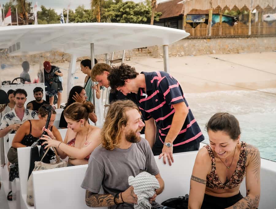 From Lembongan: Manta Point Snorkeling & West Penida Tour - The handoff from boat crew to island guide