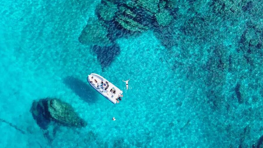 From Olbia: Dinghy Tour with Snorkeling to Tavolara Island - Tavolara’s cliffs from the sea