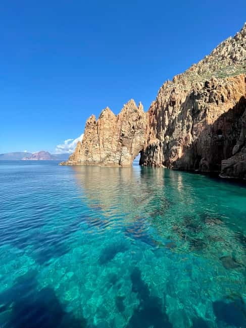 From Sagone/Cargèse: Piana Sea Caves & Snorkeling Boat Tour - Omigna Tower gives the trip a human touch