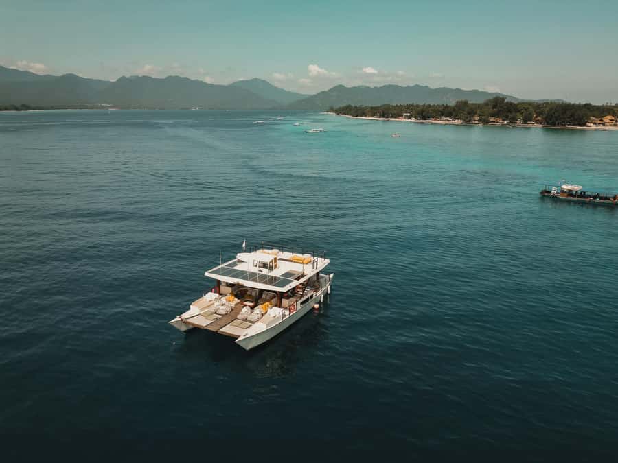 Gili Islands: 4-in-1 Catamaran Snorkeling Experience - The floating beach club stop