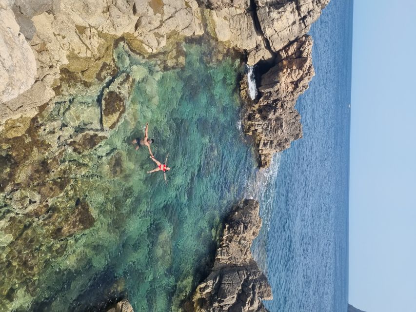 Hidden Coves, Hiking & Snorkeling Adventure in Mallorca - The first cove: rocks, clear water, and sea caves