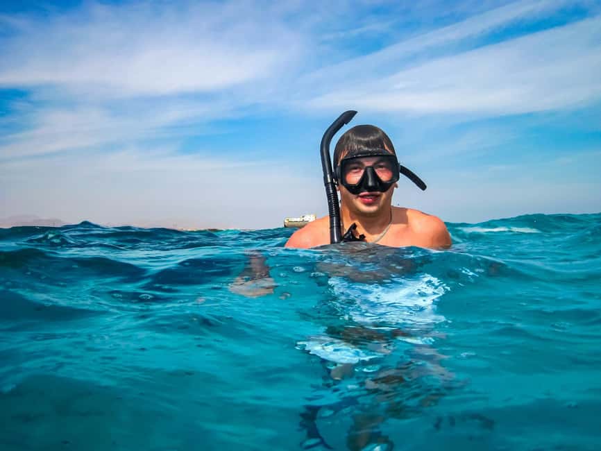 Hurghada: Dolphin & Coral Reef Snorkeling Tour with Lunch - Life on the boat between water stops