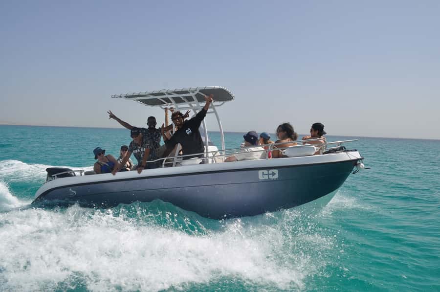 Hurghada: Orange Bay Dolphin Watching, Snorkeling & Lunch - Searching for dolphins in the open Red Sea