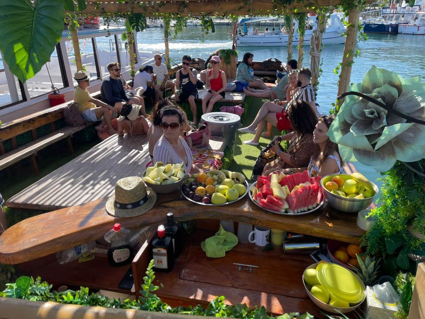 Ibiza: Sea Caves & Coves Snorkeling Paddle Boarding Tour - A sea cave, two coves, and a boat built for relaxing