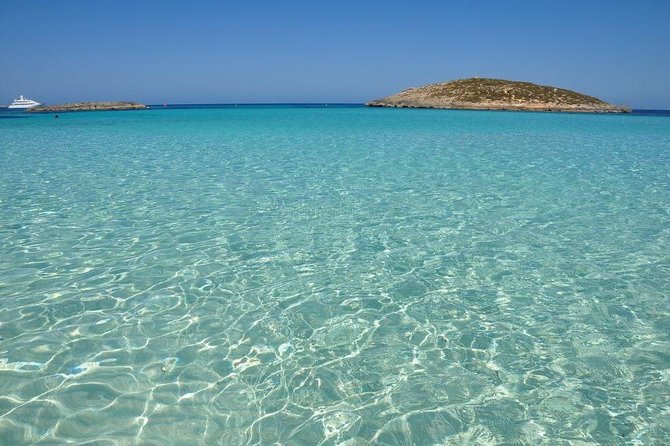 Ibiza Snorkeling Beach and Cave Tour - Snorkeling, paddleboarding, and jumping from the boat