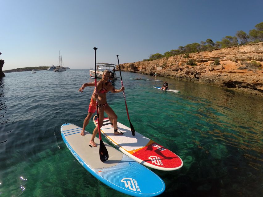 Ibiza: SUP & Snorkel Boat Tour with Caves, Drinks & Photos - Group feel, instruction, and family use