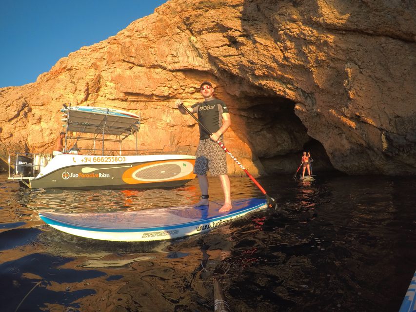 Ibiza: SUP & Snorkel Boat Tour with Caves, Drinks & Photos - Learning to stand before entering the coves