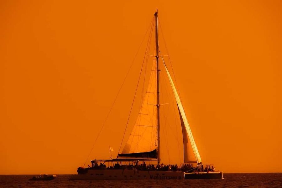 Isla Mujeres: Catamaran Ride with Open Bar, Snorkeling, and Lunch - Sailing the Caribbean on a catamaran