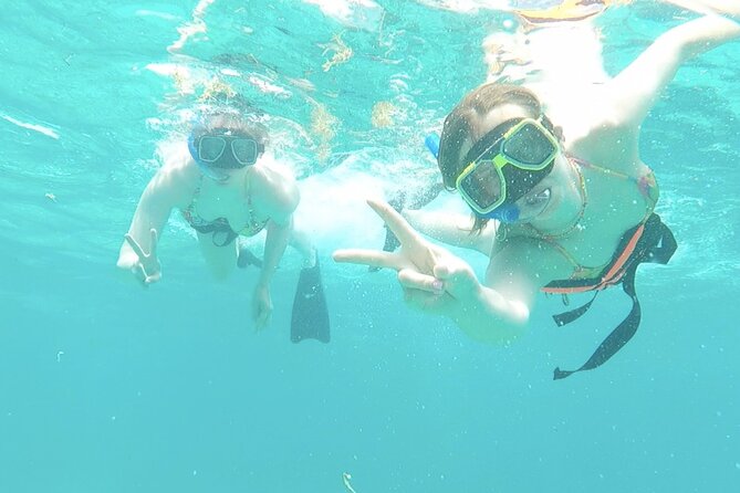 Isla Mujeres Catamaran Tour from Cancun with Snorkel and Open Bar - Transport, timing, and group size