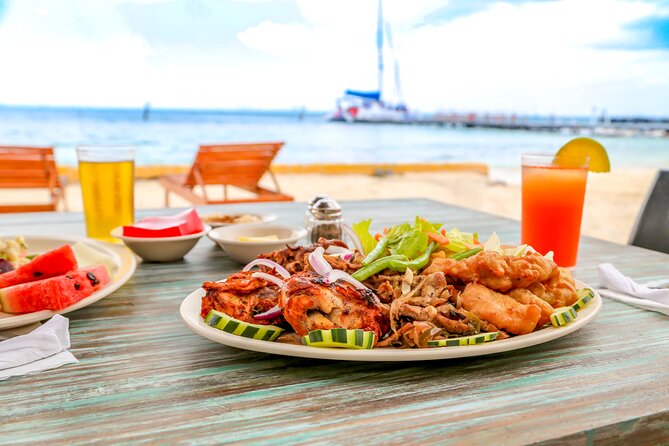 Isla Mujeres Catamaran Tour with Open Bar, Lunch and Snorkeling - Beach-club lunch on Isla Mujeres