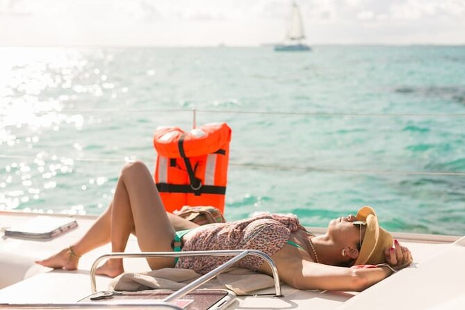 Isla Mujeres Catamaran Tour with Snorkel, Open bar and Transport - The catamaran ride: music, drinks, and a party mood