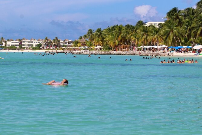 Isla Mujeres Catamaran Tour with Snorkeling at MUSA, Buffet Lunch & Open Bar - Open bar value comes with a party-cruise tradeoff