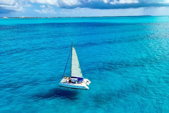 Isla Mujeres: Catamaran Tour with Snorkeling Food, Drinks, Beach - Spinnaker flight and weather limits