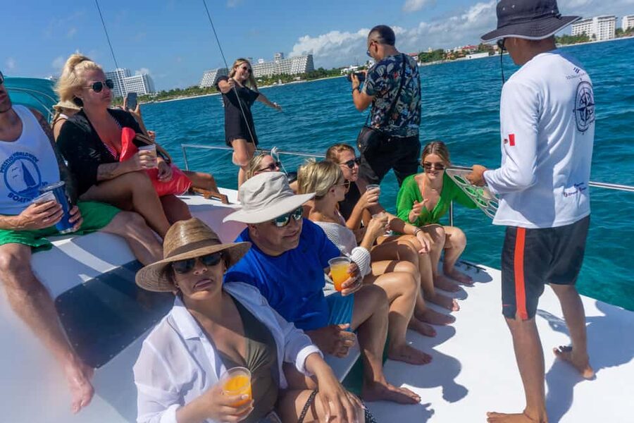 Isla Mujeres Catamaran Tour with Snorkeling & Open bar - Sailing out from Playa Tortugas