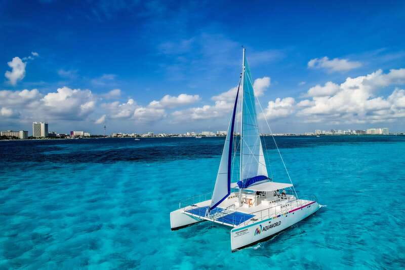 Isla Mujeres: Catamaran with Open Bar, Snorkeling and Lunch - Sailing south with music and unlimited drinks