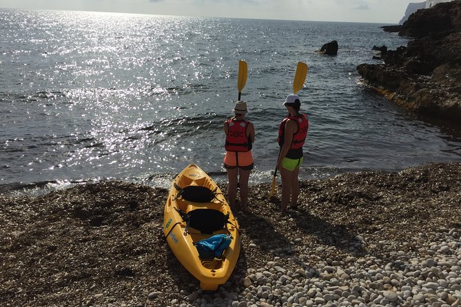 Kayak and snorkel excursion to Cova Tallada - Entering Cova Tallada with a lantern