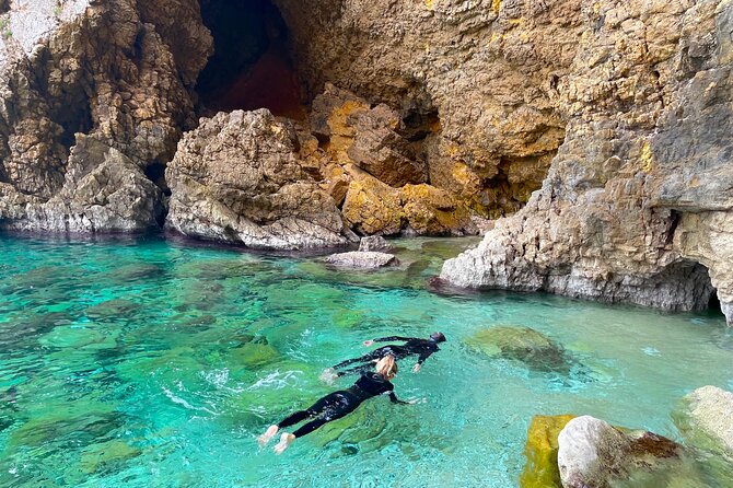 Kayak Paradise: Cala Portixol Snorkel, Cave & Cliff Jumping Tour - Isla de Portixol, caves, and the blue lagoon